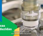 Imagem de um detalhe de um equipamento ou máquina em uma indústria e à esquerda, sobre um grafiscom de fundo verde aparece um tecto em branco escrito "taxas reduzidas" com a legenda embaixo dizendo "Desde a compra de equipamentos nacionais"